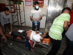 Varios de los heridos trasladados a los hospitales más cercanos presentan cortaduras en las manos y piernas. AFP